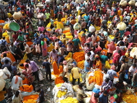 Vendors sell marigold garlands, which are used to decorate temples and homes ahead of the Diwali festival in Kolkata, India, on October 30,...