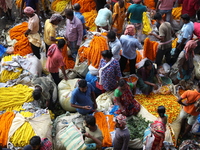 Vendors sell marigold garlands, which are used to decorate temples and homes ahead of the Diwali festival in Kolkata, India, on October 30,...