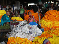 Vendors sell marigold garlands, which are used to decorate temples and homes ahead of the Diwali festival in Kolkata, India, on October 30,...