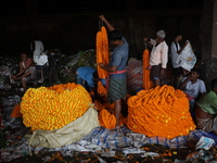 Vendors sell marigold garlands, which are used to decorate temples and homes ahead of the Diwali festival in Kolkata, India, on October 30,...