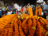 Vendors sell marigold garlands, which are used to decorate temples and homes ahead of the Diwali festival in Kolkata, India, on October 30,...