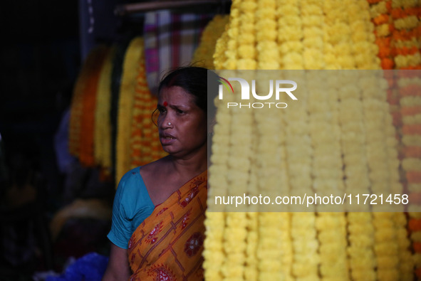 A vendor sells marigold garlands, which are used to decorate temples and homes ahead of the Diwali festival in Kolkata, India, on October 30...