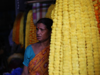 A vendor sells marigold garlands, which are used to decorate temples and homes ahead of the Diwali festival in Kolkata, India, on October 30...