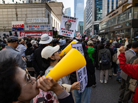 Hundreds of party members and supporters hold a protest demanding the resignation of leader Han Dong-hoon, alleging he takes an independent...