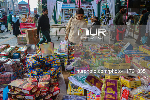 Customers buy firecrackers at a market ahead of Diwali, the Hindu festival of lights, in Srinagar, Jammu and Kashmir, on October 30, 2024. 