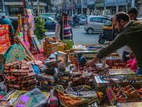 Customers buy firecrackers at a market ahead of Diwali, the Hindu festival of lights, in Srinagar, Jammu and Kashmir, on October 30, 2024. (