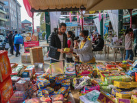 Customers buy firecrackers at a market ahead of Diwali, the Hindu festival of lights, in Srinagar, Jammu and Kashmir, on October 30, 2024. (