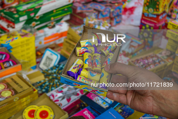 Customers buy firecrackers at a market ahead of Diwali, the Hindu festival of lights, in Srinagar, Jammu and Kashmir, on October 30, 2024. 