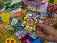 Customers buy firecrackers at a market ahead of Diwali, the Hindu festival of lights, in Srinagar, Jammu and Kashmir, on October 30, 2024. (