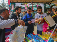 Customers buy firecrackers at a market ahead of Diwali, the Hindu festival of lights, in Srinagar, Jammu and Kashmir, on October 30, 2024. (