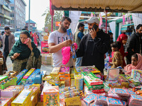 Customers buy firecrackers at a market ahead of Diwali, the Hindu festival of lights, in Srinagar, Jammu and Kashmir, on October 30, 2024. (