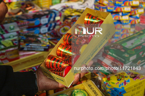 Customers buy firecrackers at a market ahead of Diwali, the Hindu festival of lights, in Srinagar, Jammu and Kashmir, on October 30, 2024. 