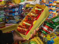 Customers buy firecrackers at a market ahead of Diwali, the Hindu festival of lights, in Srinagar, Jammu and Kashmir, on October 30, 2024. (