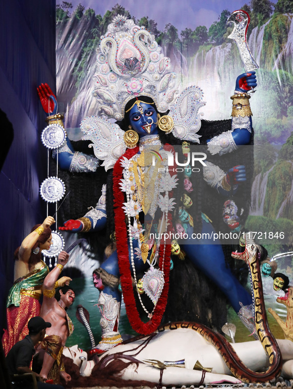 A huge clay idol of the Hindu goddess Kali is inside a ''pandal'' (a temporary platform), a decorated structure, ahead of the Kali Puja fest...