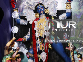 A huge clay idol of the Hindu goddess Kali is inside a ''pandal'' (a temporary platform), a decorated structure, ahead of the Kali Puja fest...