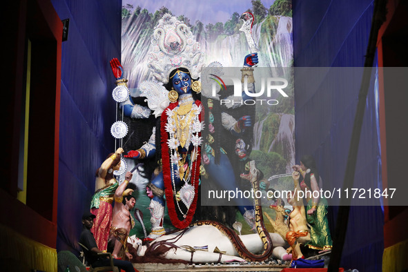 A huge clay idol of the Hindu goddess Kali is inside a ''pandal'' (a temporary platform), a decorated structure, ahead of the Kali Puja fest...