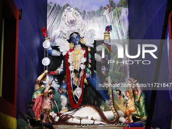 A huge clay idol of the Hindu goddess Kali is inside a ''pandal'' (a temporary platform), a decorated structure, ahead of the Kali Puja fest...