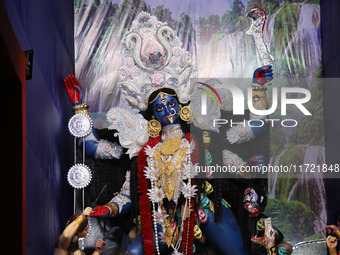 A huge clay idol of the Hindu goddess Kali is inside a ''pandal'' (a temporary platform), a decorated structure, ahead of the Kali Puja fest...