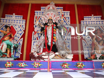 A huge clay idol of the Hindu goddess Kali is inside a ''pandal'' (a temporary platform), a decorated structure, ahead of the Kali Puja fest...