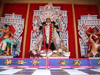 A huge clay idol of the Hindu goddess Kali is inside a ''pandal'' (a temporary platform), a decorated structure, ahead of the Kali Puja fest...