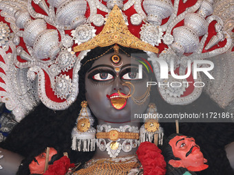 A huge clay idol of the Hindu goddess Kali is inside a ''pandal'' (a temporary platform), a decorated structure, ahead of the Kali Puja fest...