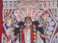 A huge clay idol of the Hindu goddess Kali is inside a ''pandal'' (a temporary platform), a decorated structure, ahead of the Kali Puja fest...