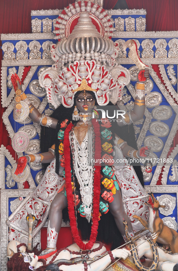 A huge clay idol of the Hindu goddess Kali is inside a ''pandal'' (a temporary platform), a decorated structure, ahead of the Kali Puja fest...