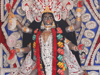 A huge clay idol of the Hindu goddess Kali is inside a ''pandal'' (a temporary platform), a decorated structure, ahead of the Kali Puja fest...