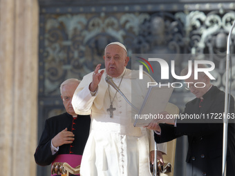 Pope Francis blesses the crowd at the end of his weekly general audience at St Peter's Square in The Vatican on October 30, 2024. (