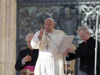 Pope Francis blesses the crowd at the end of his weekly general audience at St Peter's Square in The Vatican on October 30, 2024. (