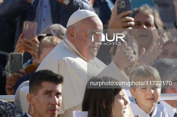 Pope Francis greets the crowd at the end of the weekly general audience at St. Peter's Square in The Vatican on October 30, 2024. 