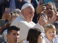 Pope Francis greets the crowd at the end of the weekly general audience at St. Peter's Square in The Vatican on October 30, 2024. (