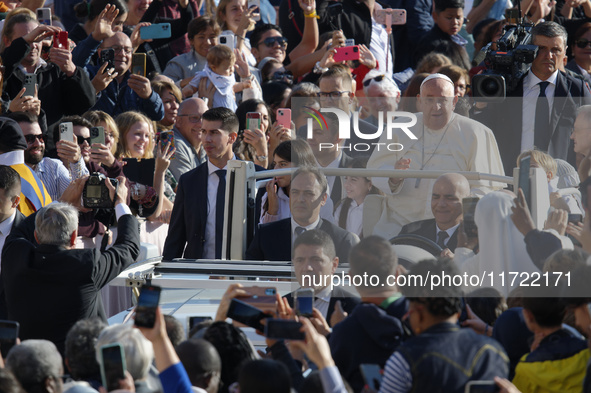 Pope Francis greets the crowd at the end of the weekly general audience at St. Peter's Square in The Vatican on October 30, 2024. 