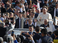 Pope Francis greets the crowd at the end of the weekly general audience at St. Peter's Square in The Vatican on October 30, 2024. (