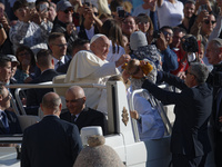 Pope Francis greets the crowd at the end of the weekly general audience at St. Peter's Square in The Vatican on October 30, 2024. (