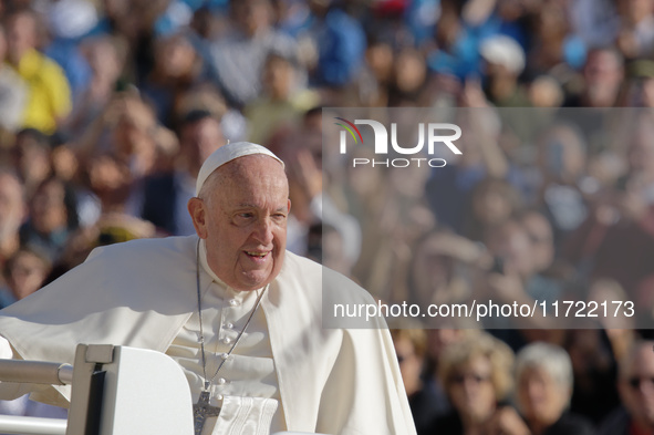 Pope Francis greets the crowd at the end of the weekly general audience at St. Peter's Square in The Vatican on October 30, 2024. 