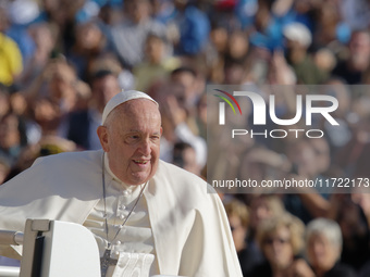 Pope Francis greets the crowd at the end of the weekly general audience at St. Peter's Square in The Vatican on October 30, 2024. (