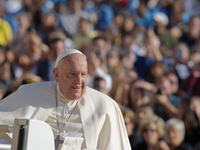 Pope Francis greets the crowd at the end of the weekly general audience at St. Peter's Square in The Vatican on October 30, 2024. (