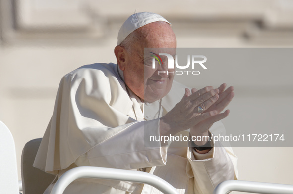 Pope Francis greets the crowd at the end of the weekly general audience at St. Peter's Square in The Vatican on October 30, 2024. 