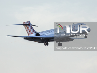 A Volotea Boeing 717-23S (registration EC-MGT) approaches Bari Airport in Bari, Italy, on November 15, 2020, casting a silhouette against th...