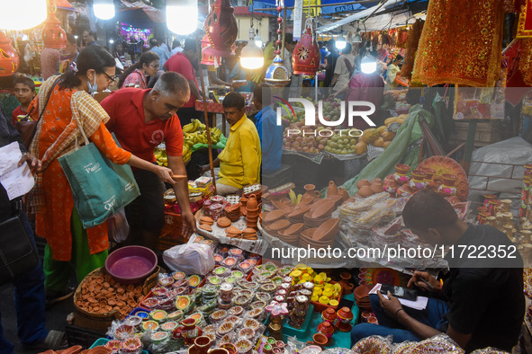 People buy clay lamps at a market ahead of the Diwali festival in Kolkata, India, on October 30, 2024. 