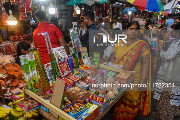 A shopkeeper sells firecrackers at a market ahead of the Diwali festival in Kolkata, India, on October 30, 2024. 