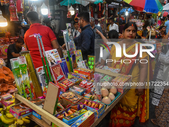 A shopkeeper sells firecrackers at a market ahead of the Diwali festival in Kolkata, India, on October 30, 2024. (