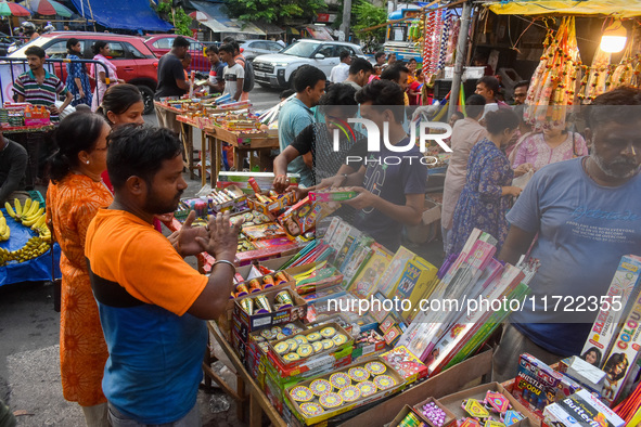 A shopkeeper sells firecrackers at a market ahead of the Diwali festival in Kolkata, India, on October 30, 2024. 