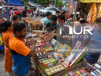 A shopkeeper sells firecrackers at a market ahead of the Diwali festival in Kolkata, India, on October 30, 2024. (