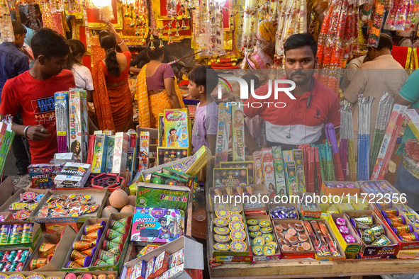 A shopkeeper sells firecrackers at a market ahead of the Diwali festival in Kolkata, India, on October 30, 2024. 