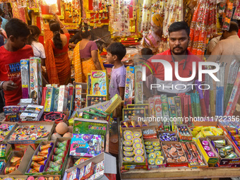 A shopkeeper sells firecrackers at a market ahead of the Diwali festival in Kolkata, India, on October 30, 2024. (