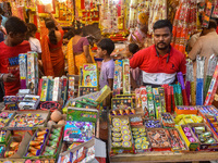 A shopkeeper sells firecrackers at a market ahead of the Diwali festival in Kolkata, India, on October 30, 2024. (