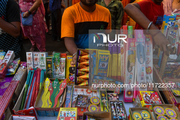 A shopkeeper sells firecrackers at a market ahead of the Diwali festival in Kolkata, India, on October 30, 2024. 