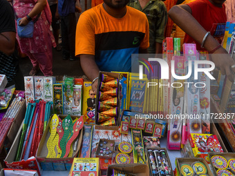 A shopkeeper sells firecrackers at a market ahead of the Diwali festival in Kolkata, India, on October 30, 2024. (